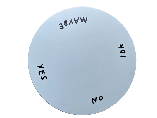 Top view of the white Indecisive Lazy Susan with yes, no, maybe, and IDK lettered around the rim