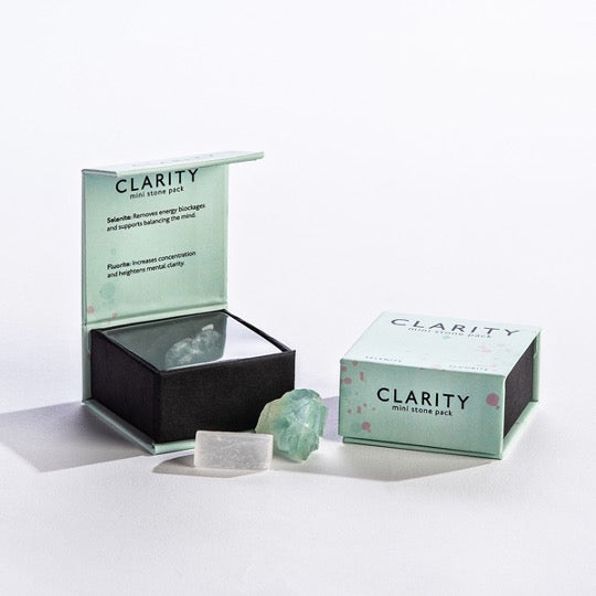 Light green box with 1 selenite stone and 1 flourite stone.