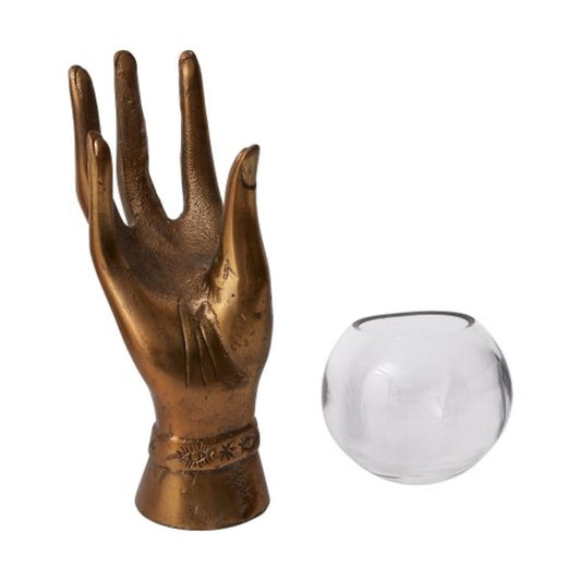 Metal hand in aged brass with a glass round bowl.