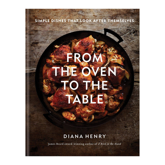 From the Oven to the Table by Diana Henry, cover showing roast chicken and vegetables in a black pan on wood