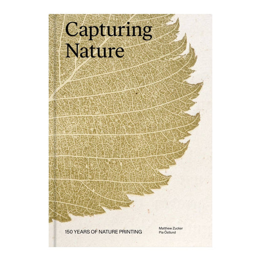 Capturing Nature hardcover standing upright, gold leaf print on cream cover, subtitle 150 Years of Nature Printing