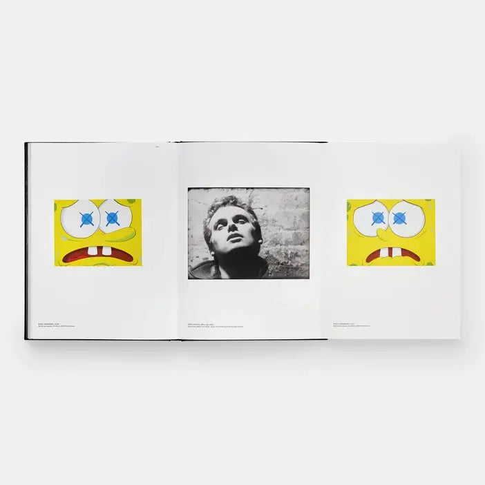 Open Kaws + Warhol foldout with two yellow KAWS cartoon faces flanking a black and white portrait
