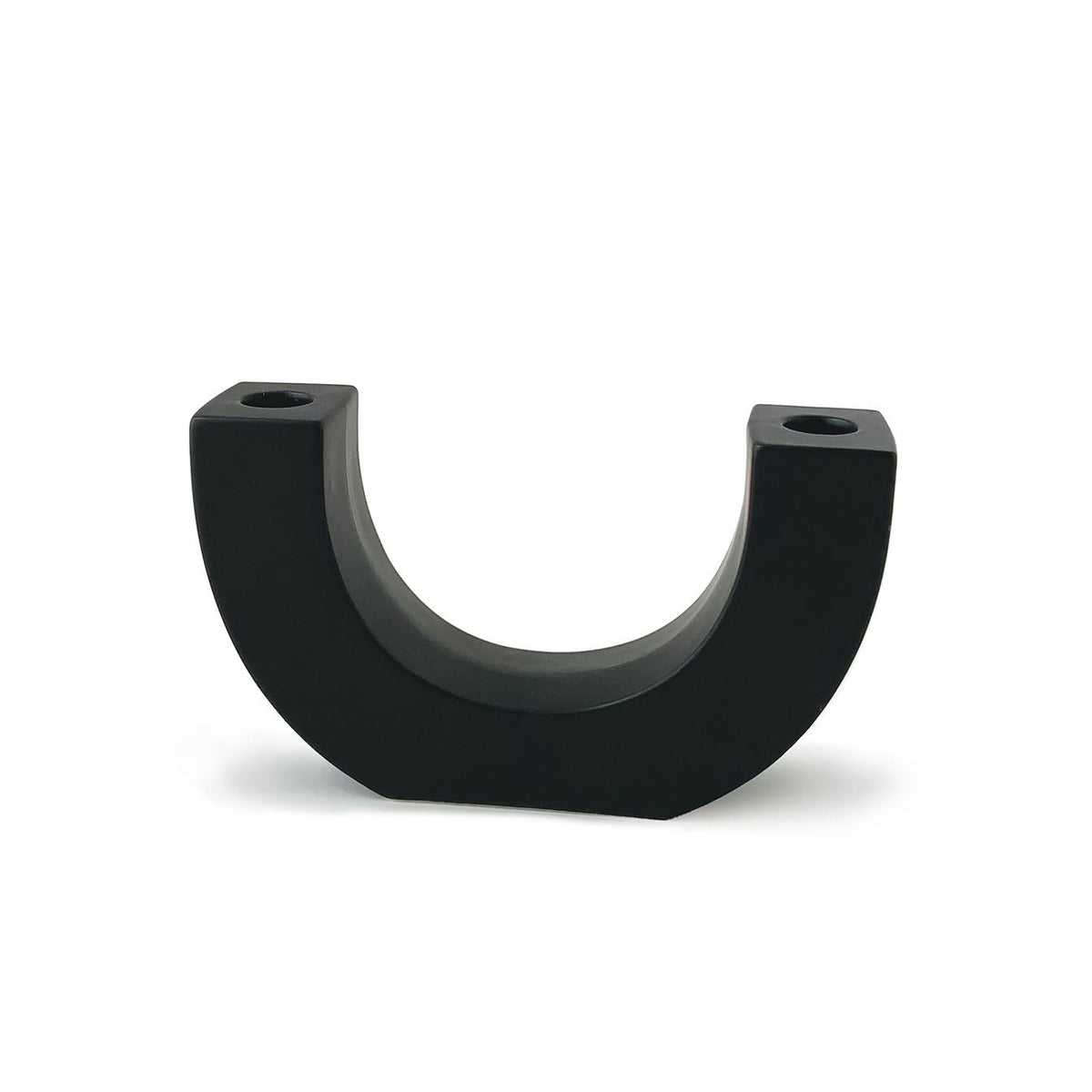 U-shaped matte black ceramic taper holder with a candle opening at the top of each end