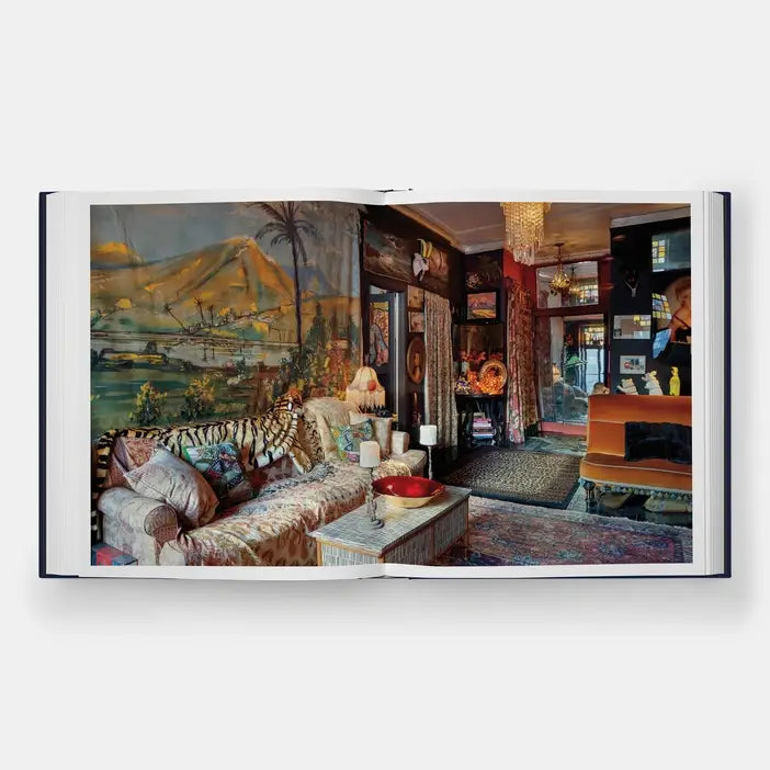 Hotel Chelsea book spread with a full-bleed photo of a living room with a mural, tiger-print sofa, and rugs