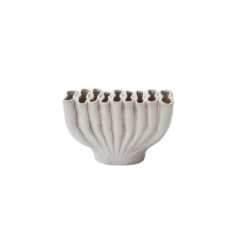 Smaller Clymene vase on its own, showing the ribbed fan shape and speckled warm white glaze