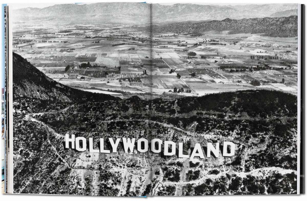 Open book spread with a black and white aerial photo of the Hollywoodland sign above the valley