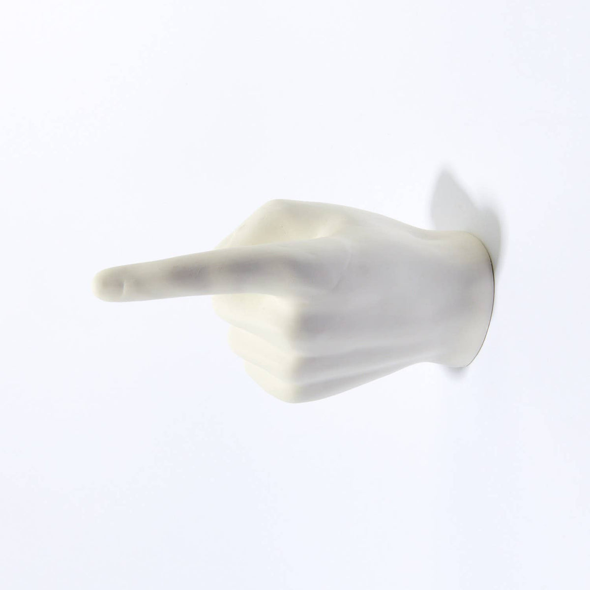 White pointing hand wall hook shown empty from the opposite side, finger pointing left