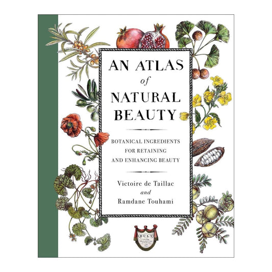 An Atlas of Natural Beauty book cover with hand-drawn botanicals framing the title and a green spine edge