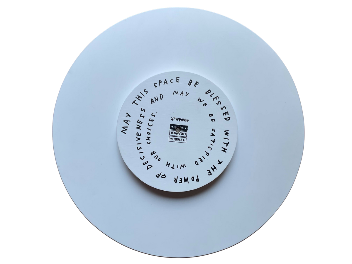 Underside of the Indecisive Lazy Susan with a spiral blessing about the power of decisiveness