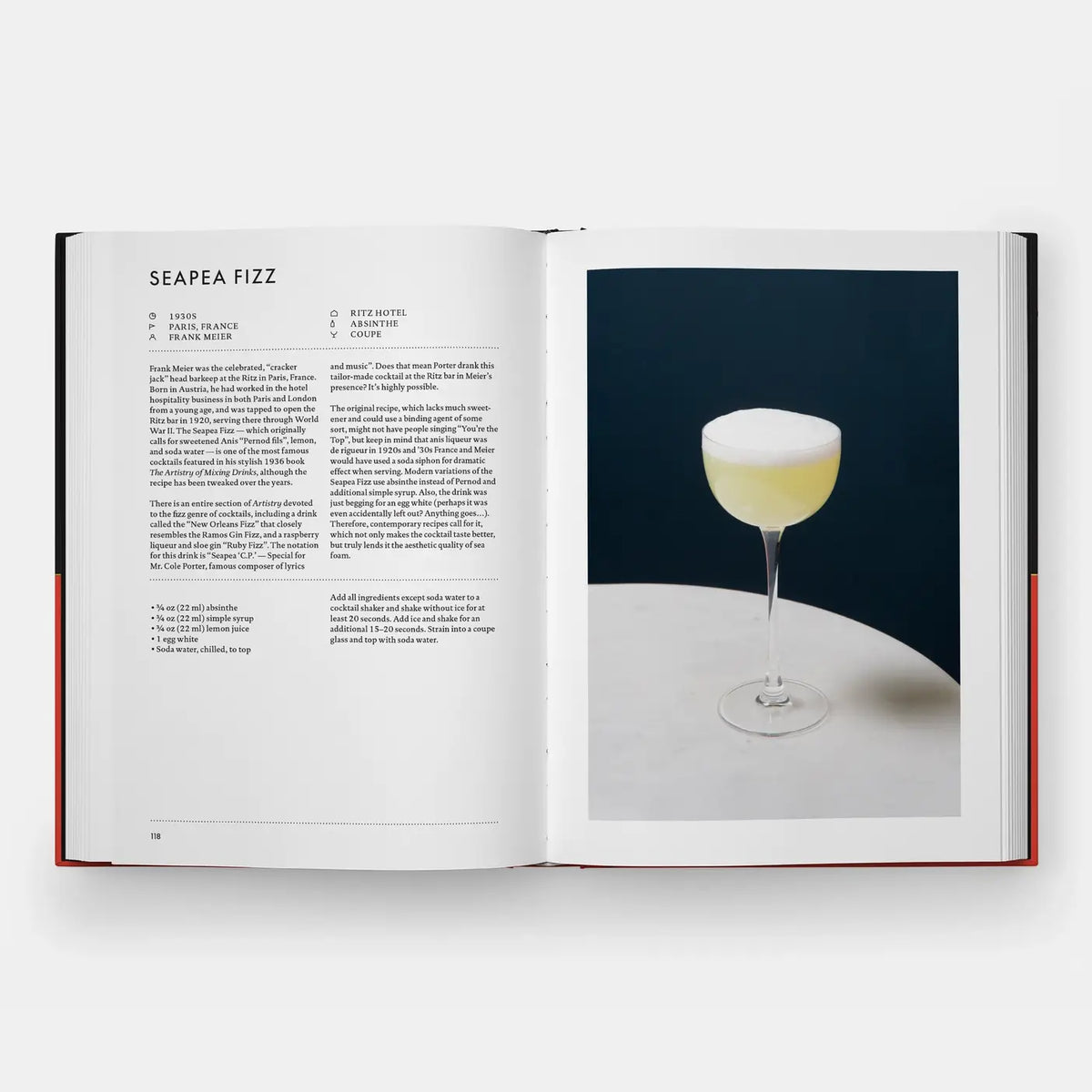 Signature Cocktails open to the Seapea Fizz recipe with a pale yellow foamy drink in a coupe