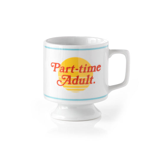 White pedestal mug with blue stripes and Part-time Adult. in red over a yellow sunset graphic