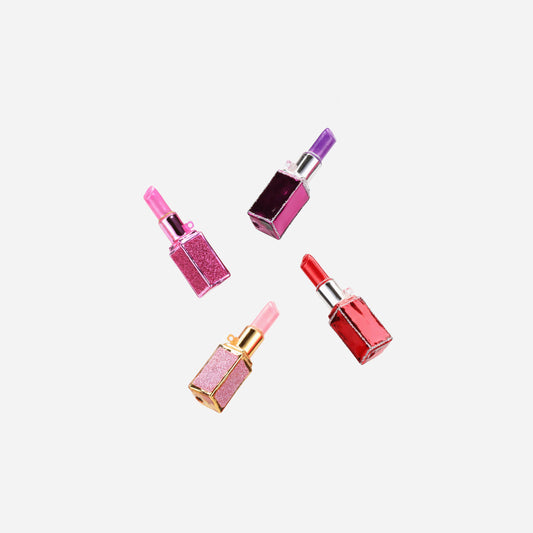 Four glittery glass lipstick ornaments in pink, plum, red and pale pink with metallic caps