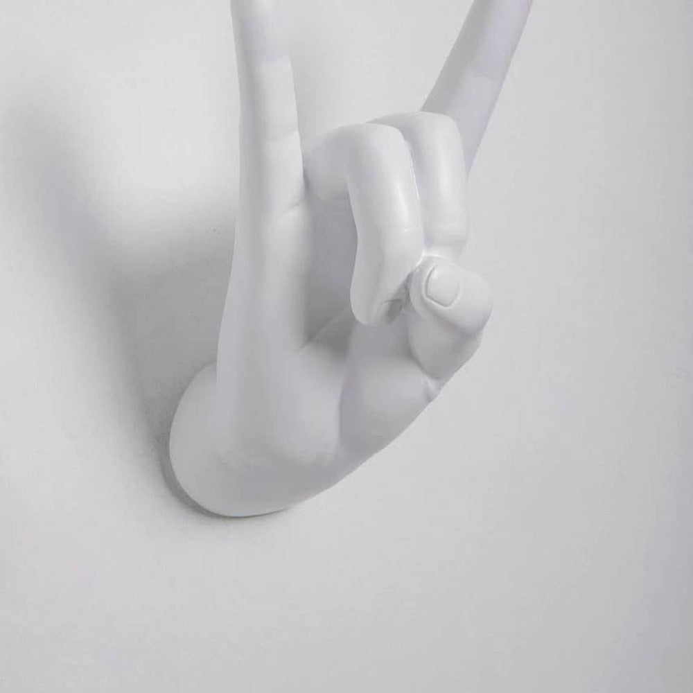 Close-up of the white Rock On hand hook showing the curled fingers and thumb