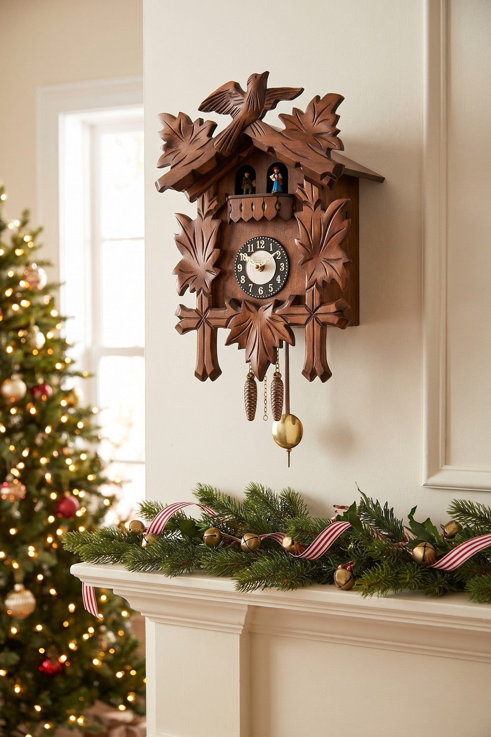 Carved Black Forest mini clock on a wall above a holiday mantel