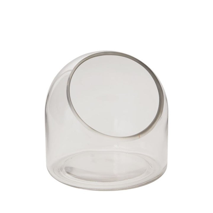 Glass terrarium with slanted cut edge.