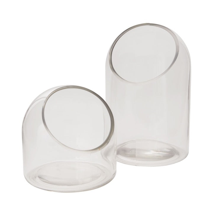 Set of glass terrariums with slanted cut edge.