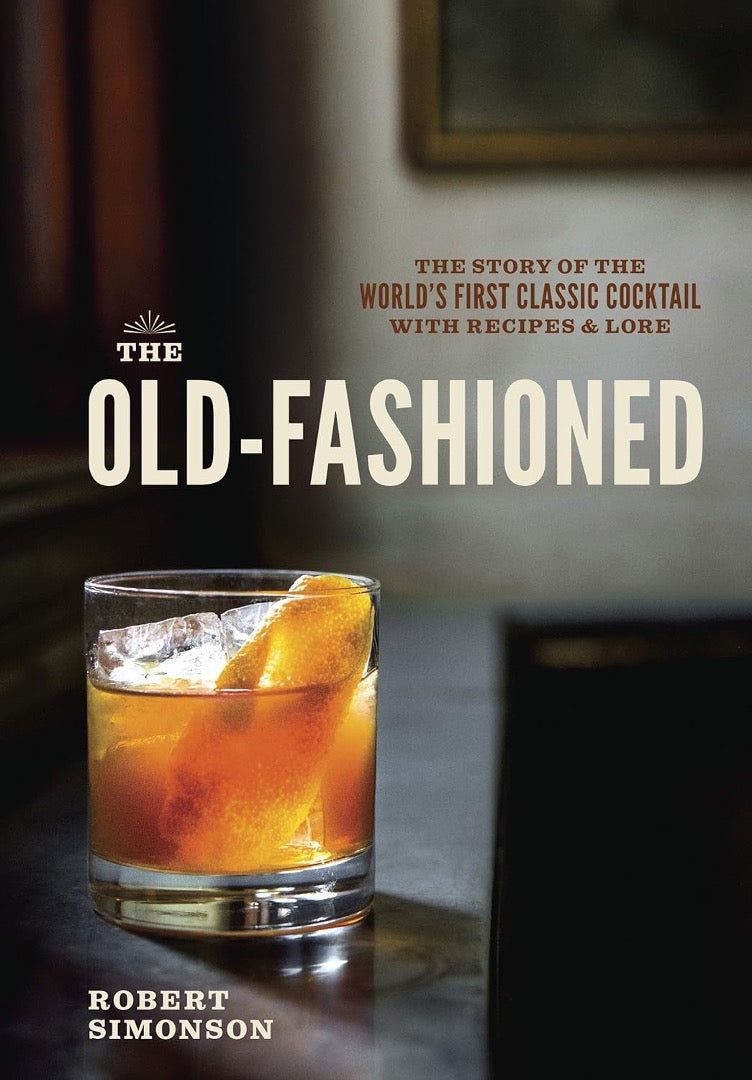 Full-bleed cover of The Old-Fashioned showing the cocktail on a dark bar top up close