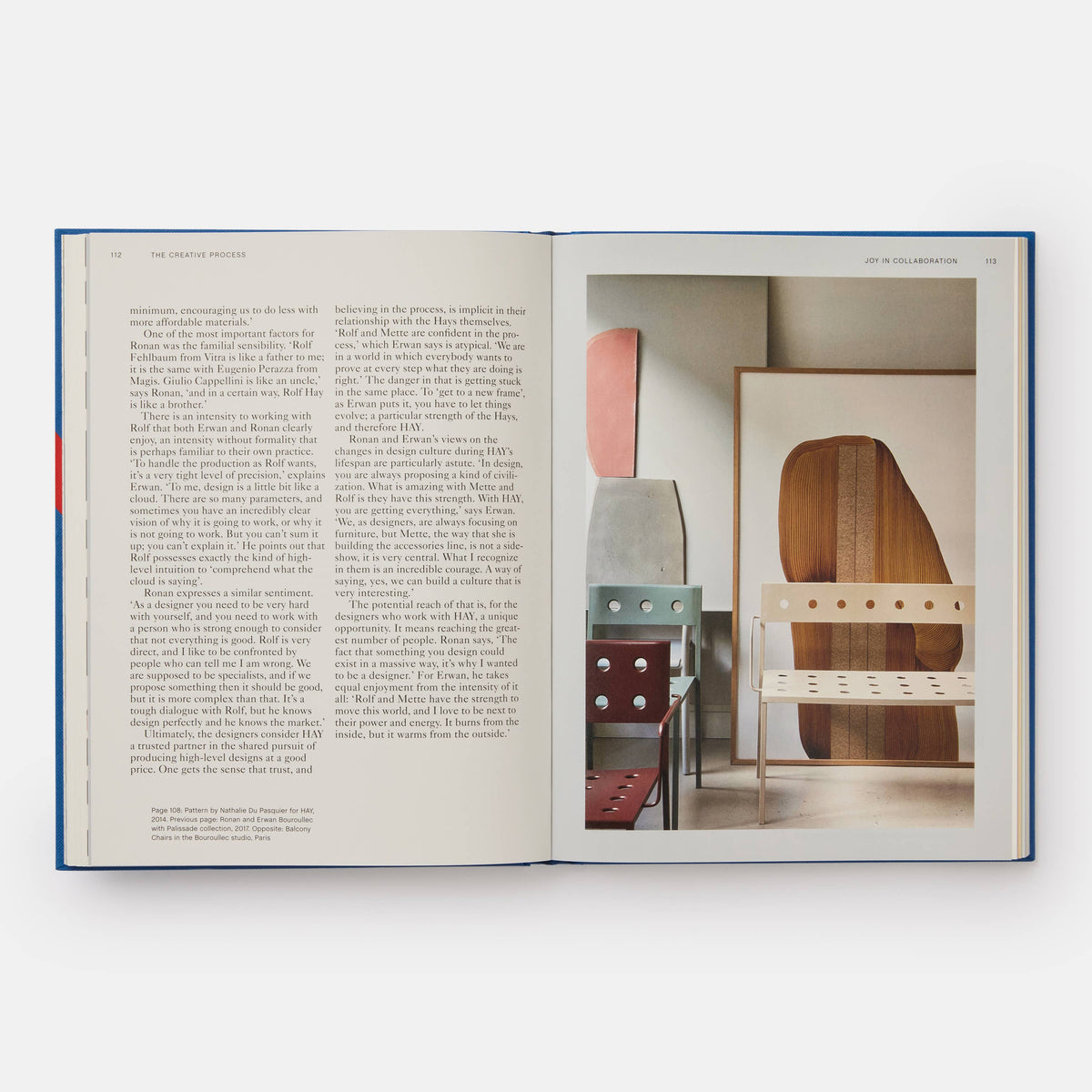Open HAY book with a text page facing a photo of chairs and wood panels in a studio