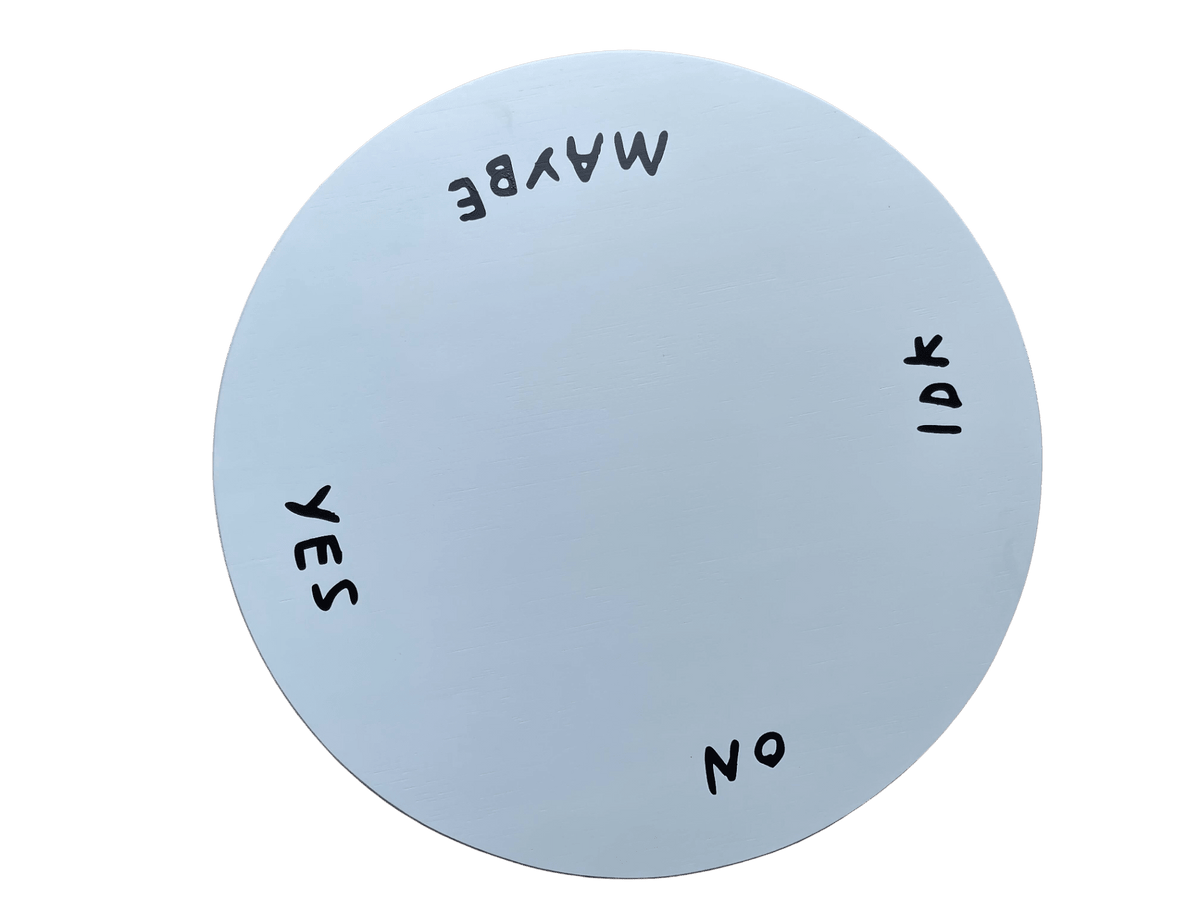 Top view of the white Indecisive Lazy Susan with yes, no, maybe, and IDK lettered around the rim