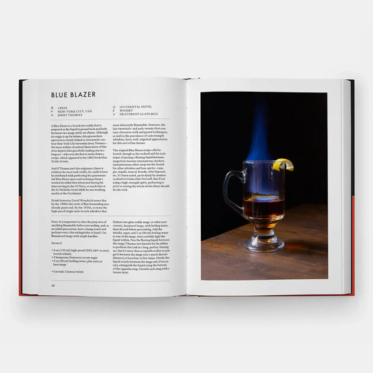 Signature Cocktails open to the Blue Blazer recipe beside a photo of a flaming drink in a glass mug