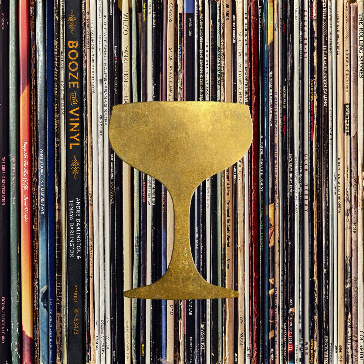Booze & Vinyl book cover with a gold coupe glass over a wall of record album spines