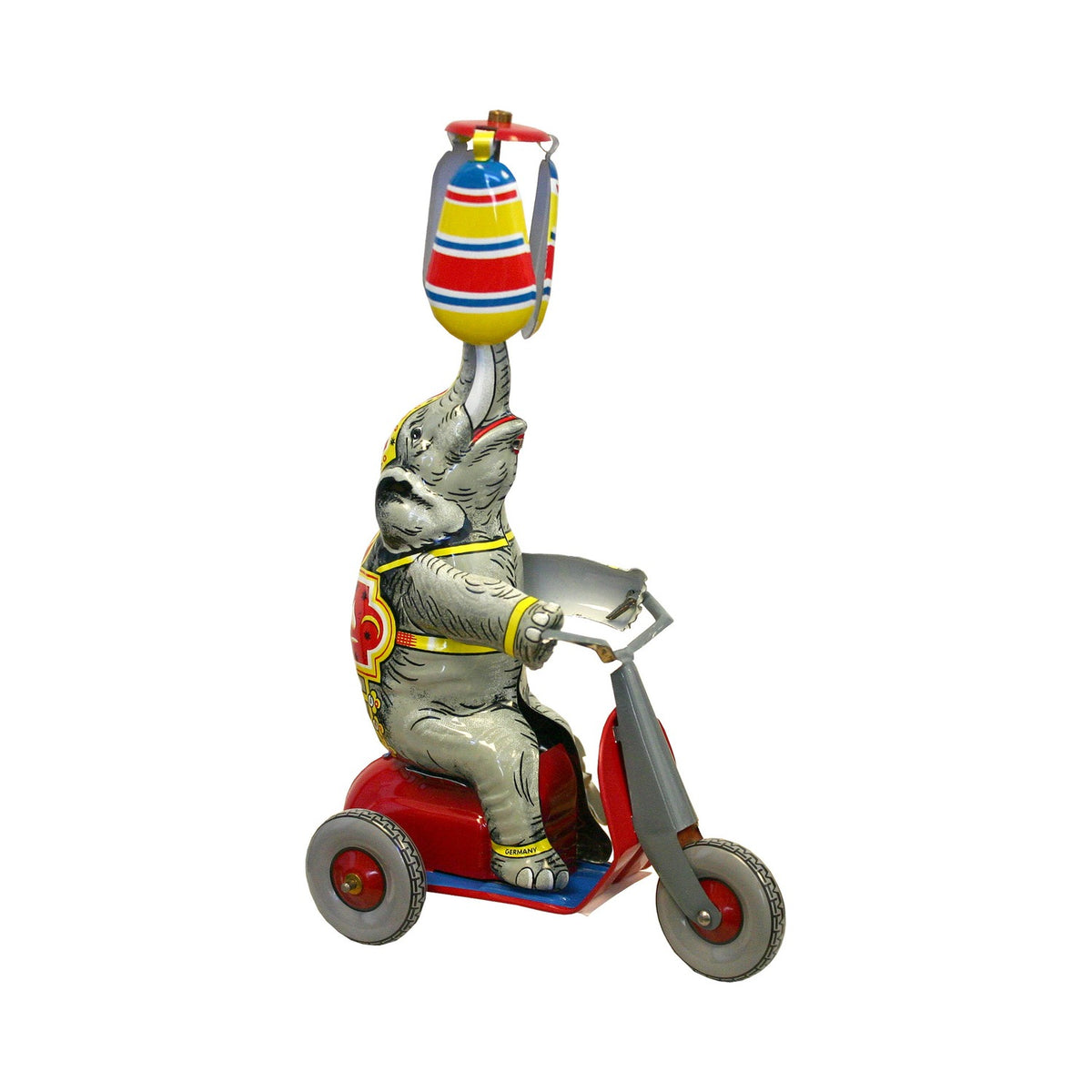 Wind-up tin circus elephant riding a scooter