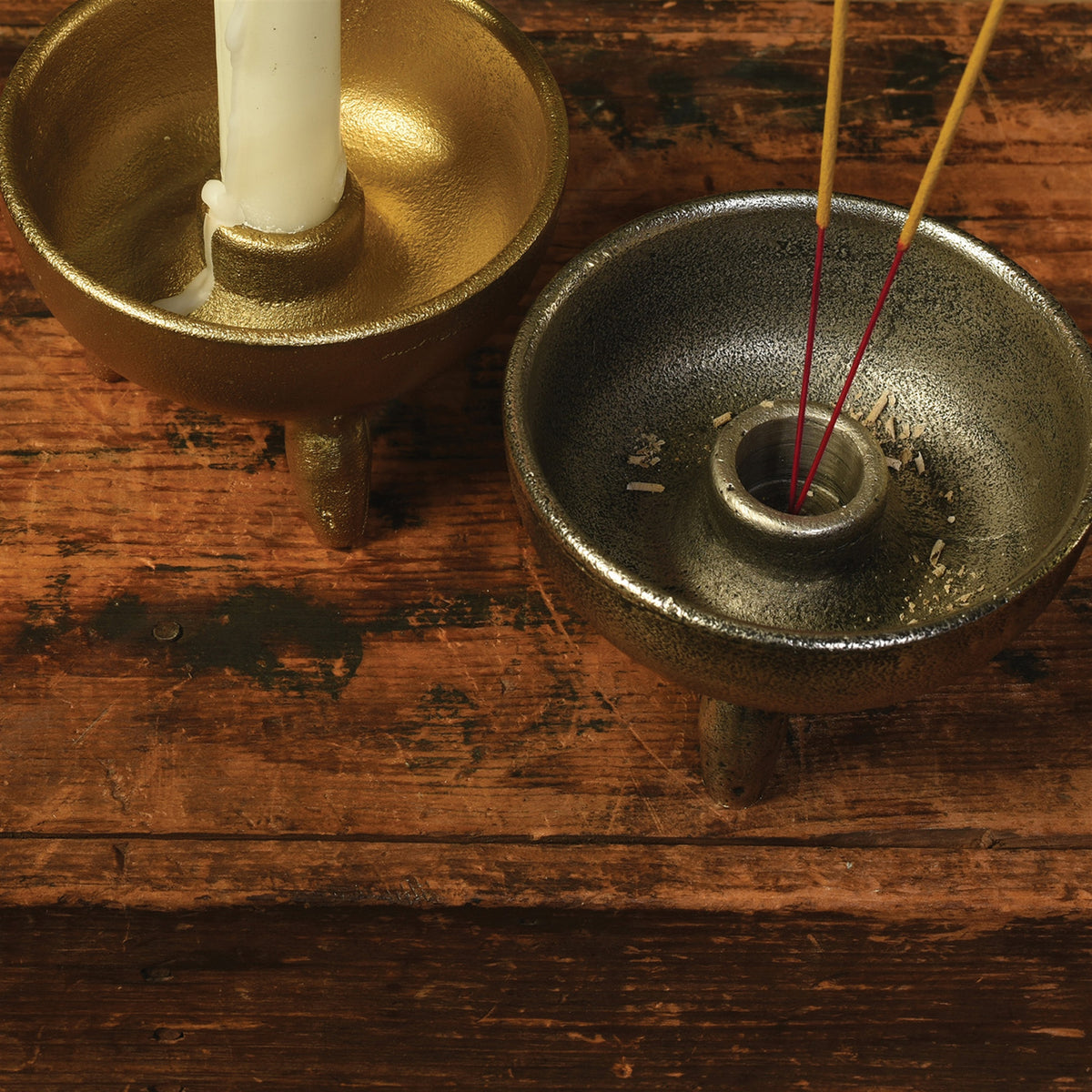 Pair of incense or taper holder in antique brass and nickel on distressed wood