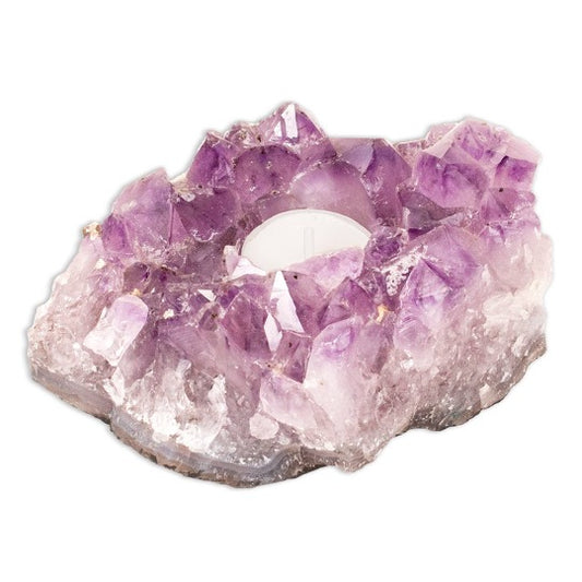 Amethyst cluster with votive candle in center. 