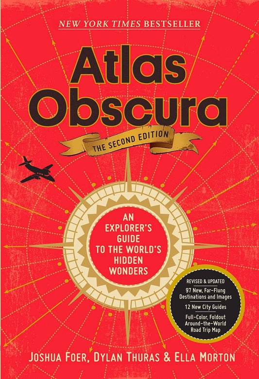 Close-up of the red Atlas Obscura cover with map lines, compass badge and An explorer's guide subtitle