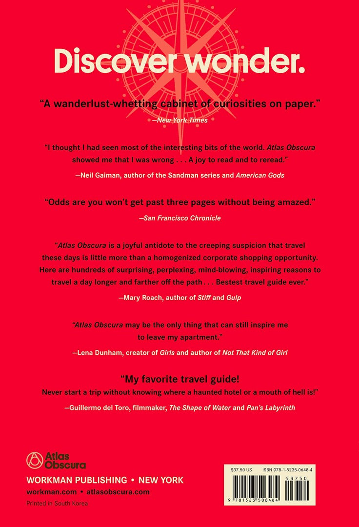 Red back cover of Atlas Obscura reading Discover wonder, with press quotes from the New York Times and others