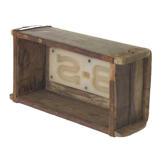 Weathered wood brick mould with rusted metal trim and a cream stamp plate reading B-S inside, shown empty