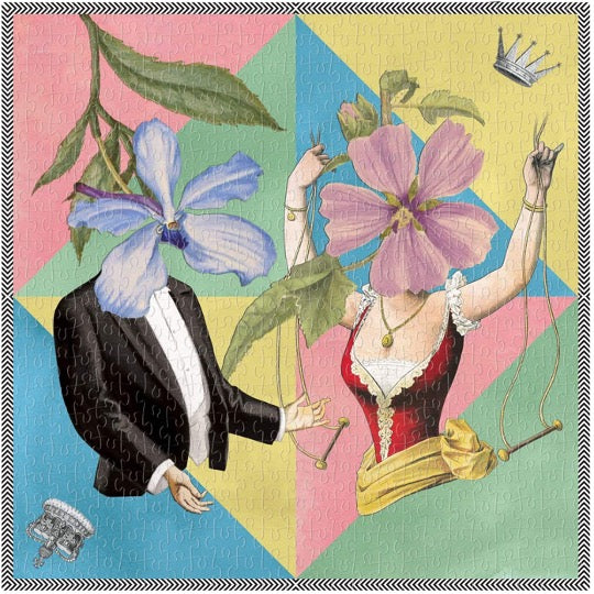 Christian Lacroix puzzle, whimsical illustrated art depicting male & female figures with floral faces. Pastel colored triangles in background. Puzzle fully assembled