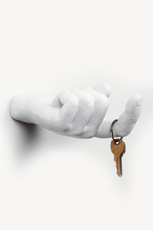 Tall view of the white Come Here hand wall mount with curled fingers and keys hanging from its extended finger
