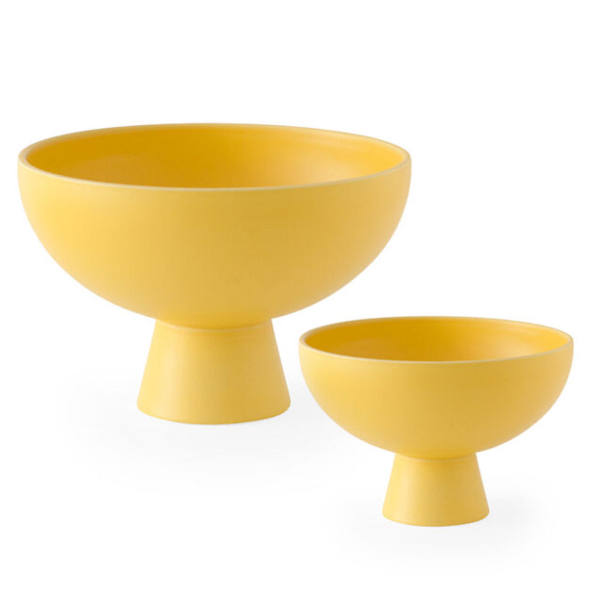 Two yellow Strom footed bowls in a matte finish, large and small side by side