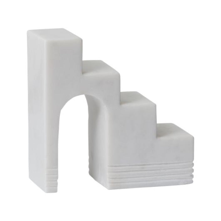 White marble geometric staircase sculpture.