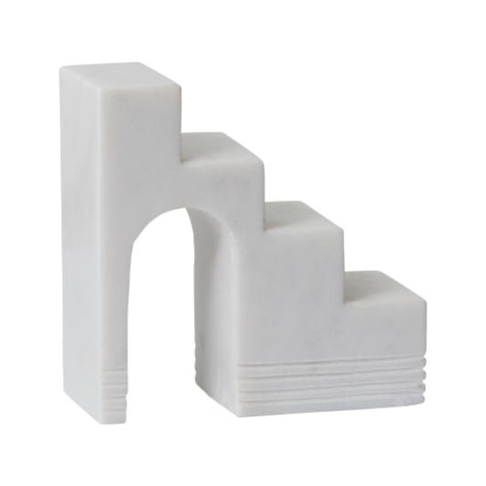 White marble geometric staircase sculpture.