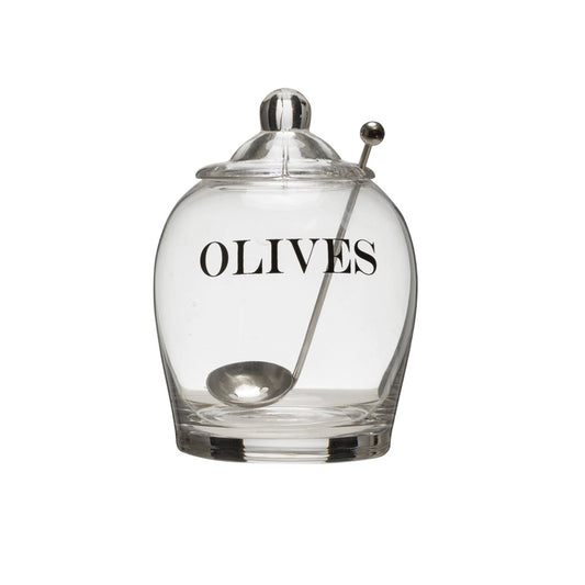 Clear glass olive jar with OLIVES in black lettering, knobbed glass lid and a steel spoon through the lid