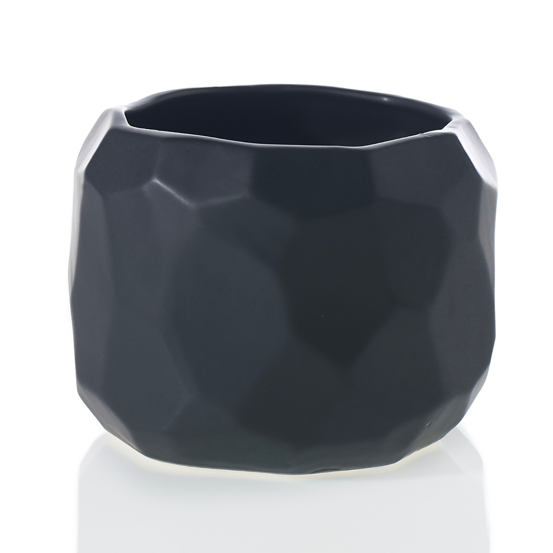 Miro pot in matte black with irregular faceted sides, shown on its own at eye level