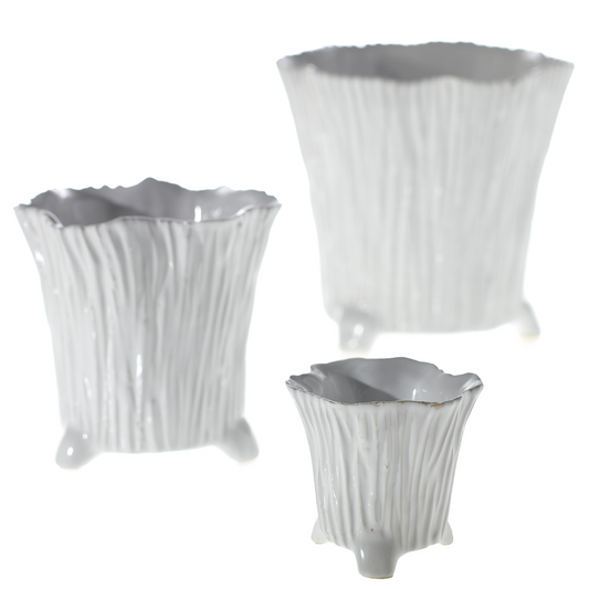 Three white Mellie pots in small, medium, and large with bark-like ribbing and little feet