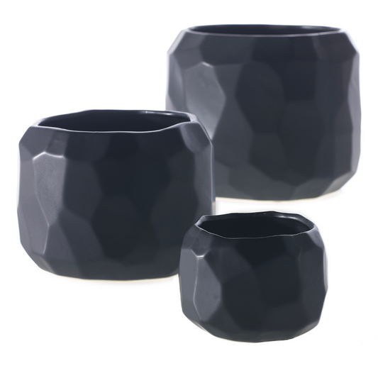 Miro pots in three sizes, matte black ceramic with faceted geometric sides