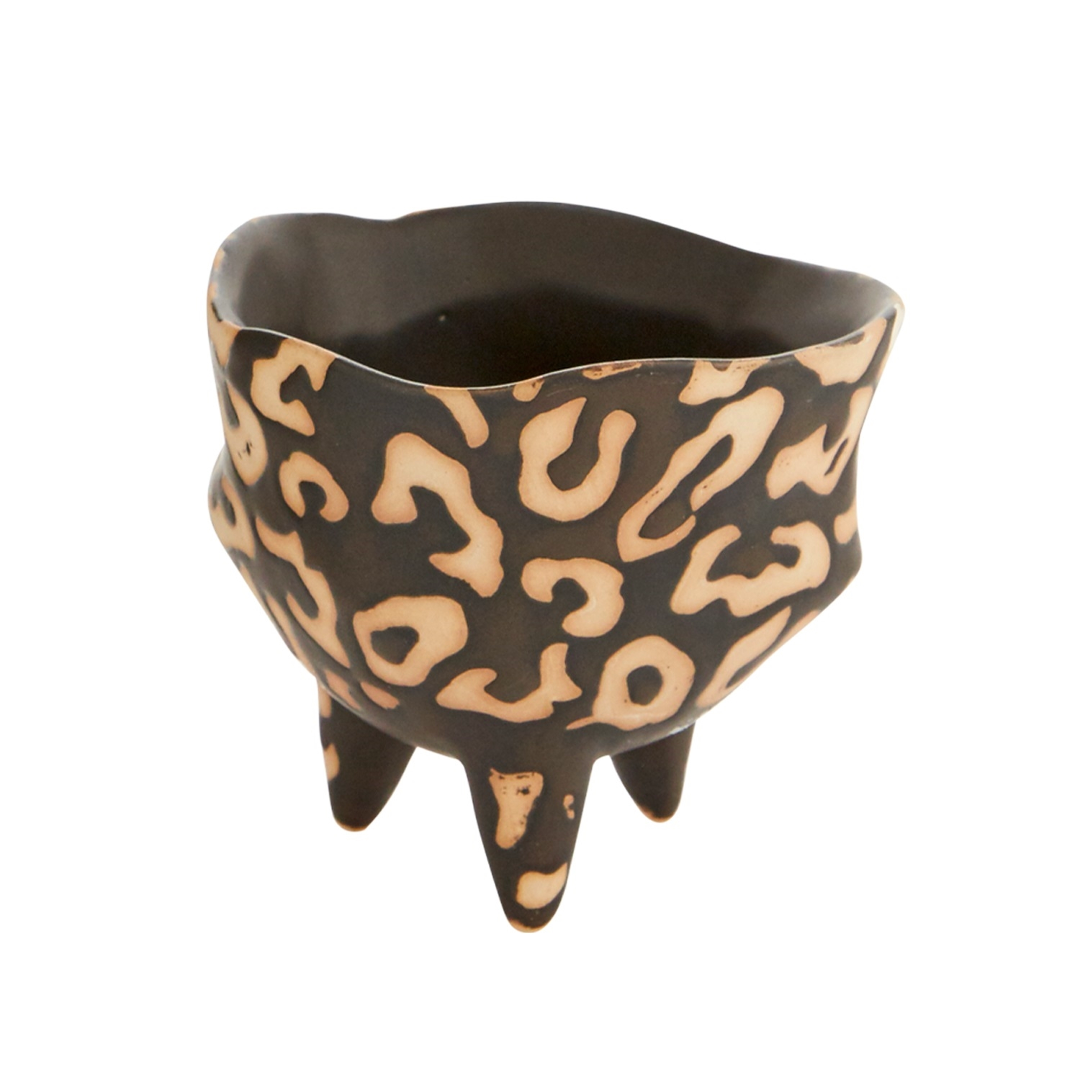 Single Leesi pot shown from a slight angle, highlighting its wavy rim and three feet