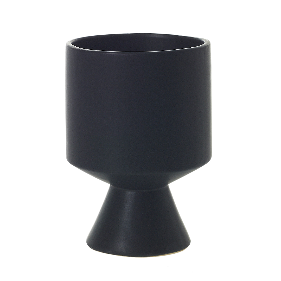 Matte black ceramic De Vil pot standing alone on white, highlighting its goblet-like silhouette