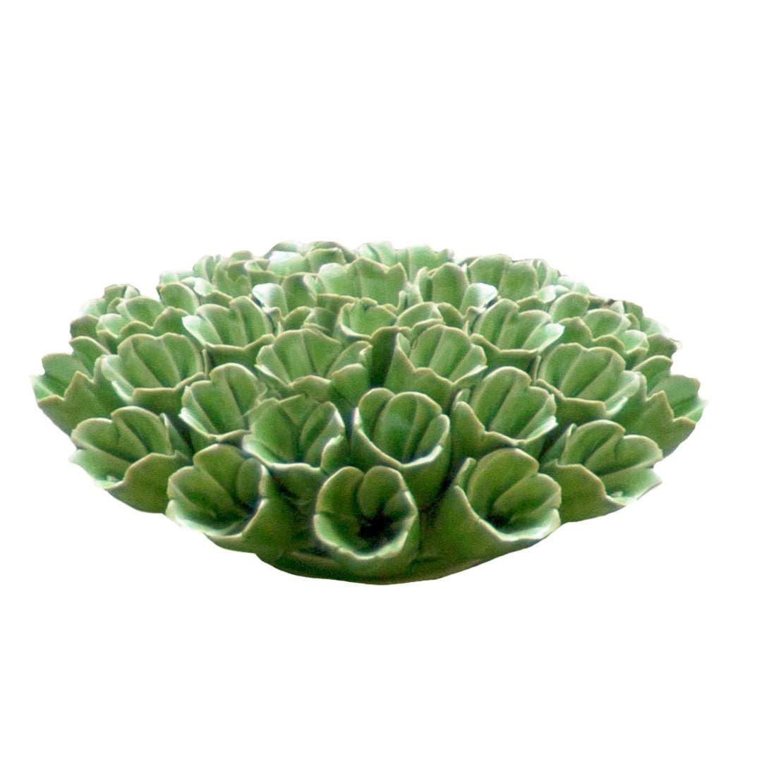 Ceramic sea polyp in green, side view.