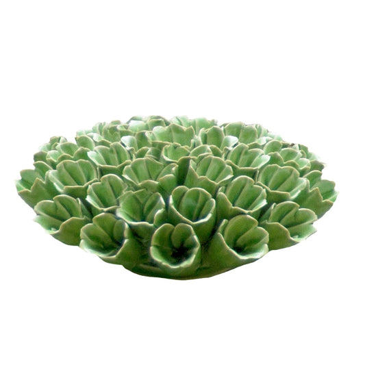 Ceramic sea polyp in green, side view.
