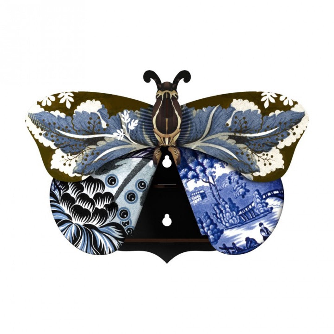 Tosca butterfly wall cabinet with blue and white toile and floral wings around a black shelved center