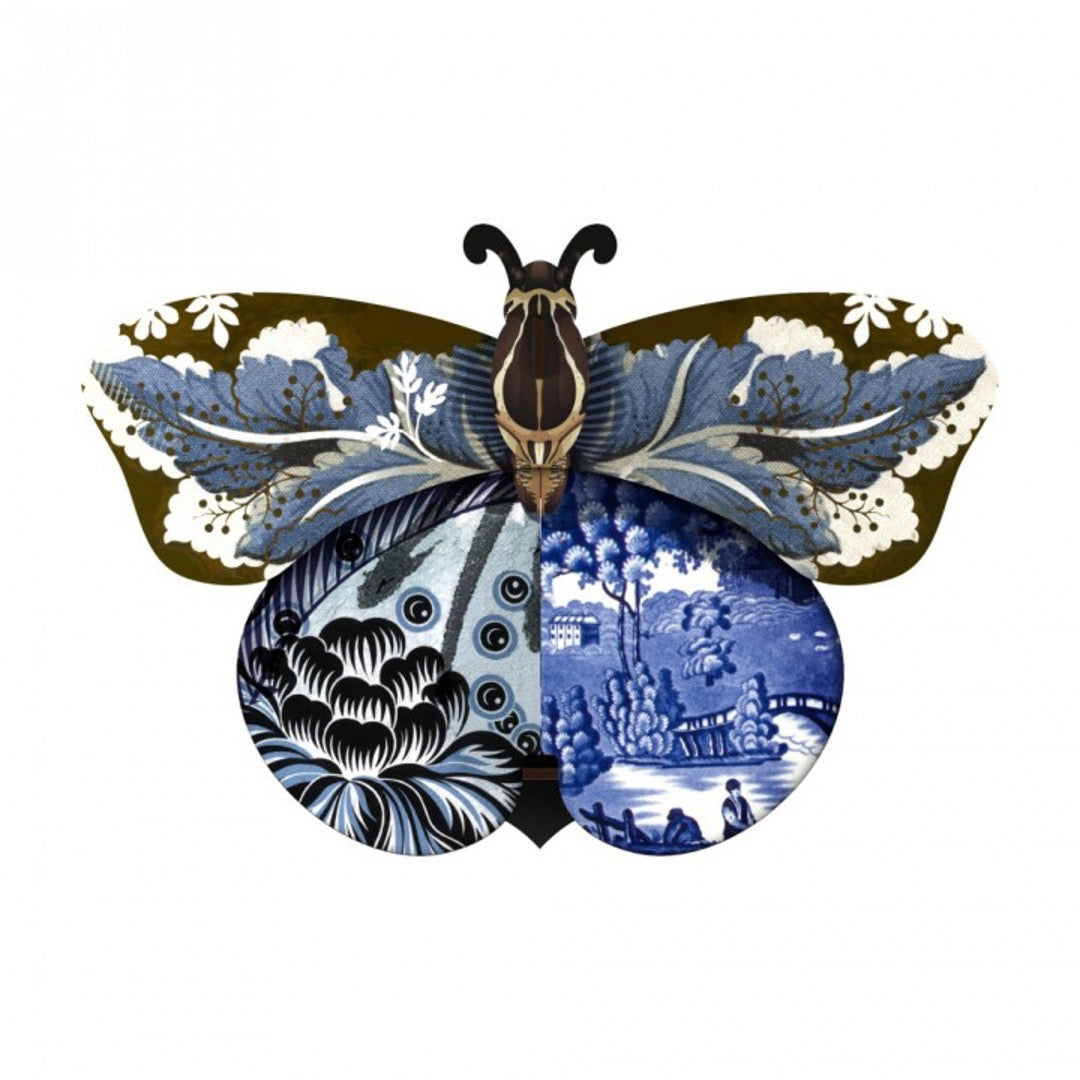 Tosca butterfly wall cabinet with a collage of blue and black patterns