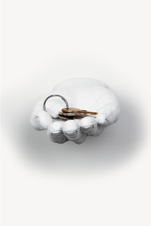 White Hand Out wall mount holding keys, shown straight on against a pale wall